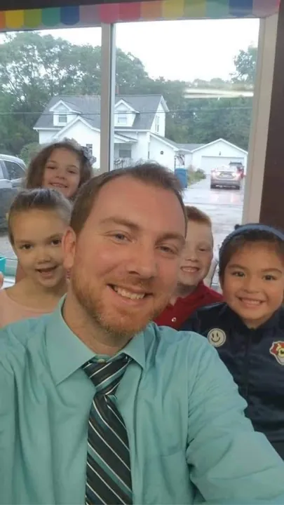 A teacher with students at the academy